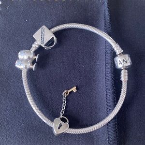 Pandora bracelet with 3 charms. Inquire about purchasing bracelet alone.